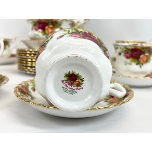 459 - A 26 piece Royal Albert Old Country Roses tea set. 10 sandwich plates, 6 cups, 7 saucers, milk jug, ... 