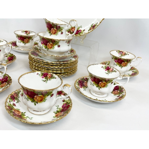 459 - A 26 piece Royal Albert Old Country Roses tea set. 10 sandwich plates, 6 cups, 7 saucers, milk jug, ... 