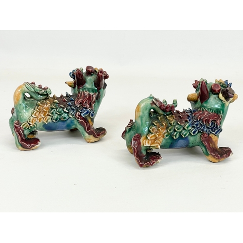 462 - A pair of early to mid 20th century Chinese pottery Foo Dogs. 13cm