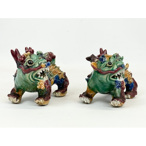 462 - A pair of early to mid 20th century Chinese pottery Foo Dogs. 13cm