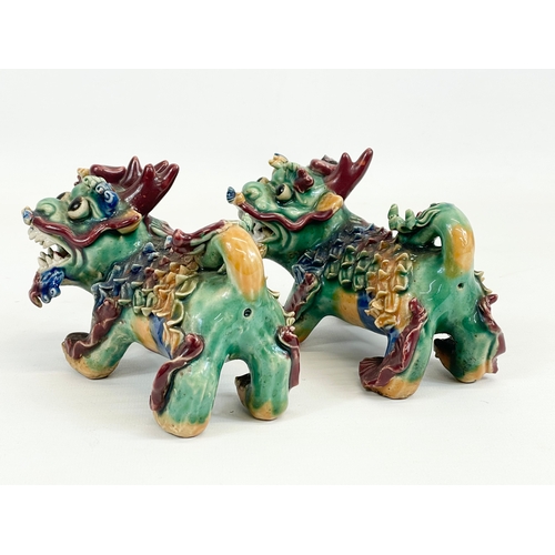 462 - A pair of early to mid 20th century Chinese pottery Foo Dogs. 13cm