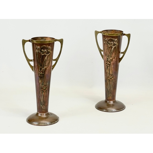 472 - A pair of Art Nouveau copper and brass vases, by Beldray. England. 28cm