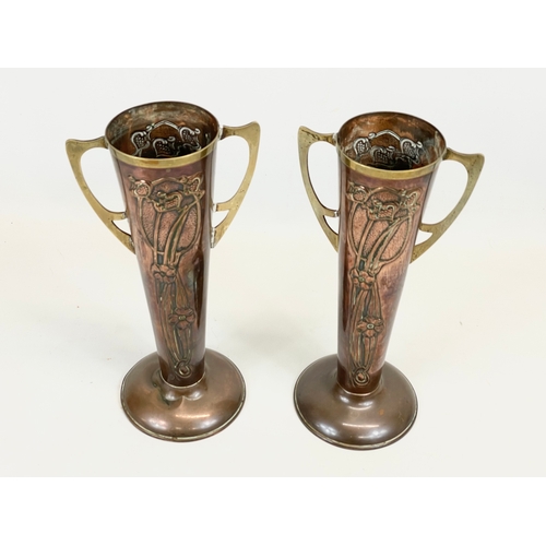 472 - A pair of Art Nouveau copper and brass vases, by Beldray. England. 28cm