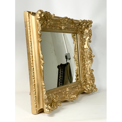 45 - A Victorian ornate gilt framed mirror. Repainted. 77 x 13 x 63cm