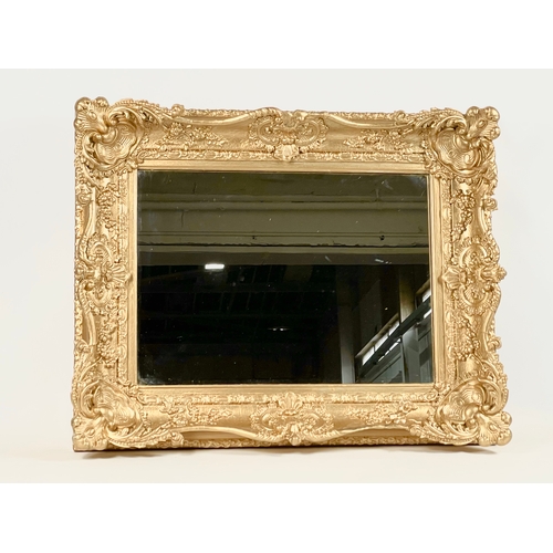 45 - A Victorian ornate gilt framed mirror. Repainted. 77 x 13 x 63cm