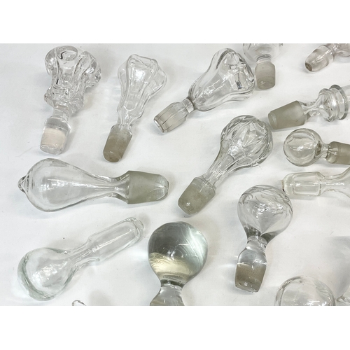 477 - A quantity of Georgian, Victorian and Edwardian glass decanters tops.