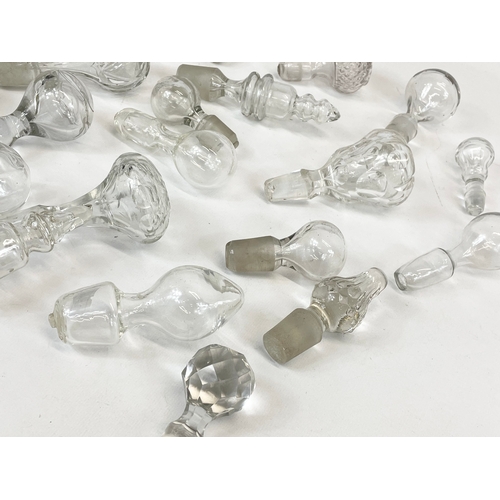 477 - A quantity of Georgian, Victorian and Edwardian glass decanters tops.