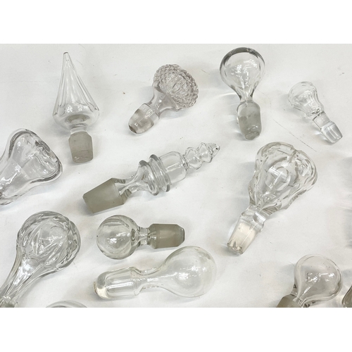 477 - A quantity of Georgian, Victorian and Edwardian glass decanters tops.