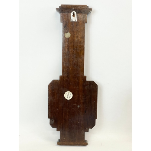 48 - An Edwardian inlaid barometer. 20 x 56cm