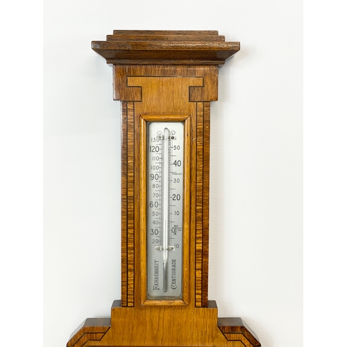 48 - An Edwardian inlaid barometer. 20 x 56cm