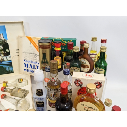 49 - A large quantity of miniatures. Mostly unopened. Including Bell's Scotch Whisky, Southern Comfort, I... 