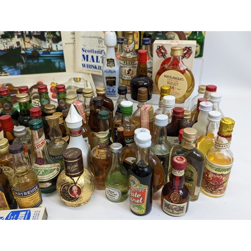 49 - A large quantity of miniatures. Mostly unopened. Including Bell's Scotch Whisky, Southern Comfort, I... 