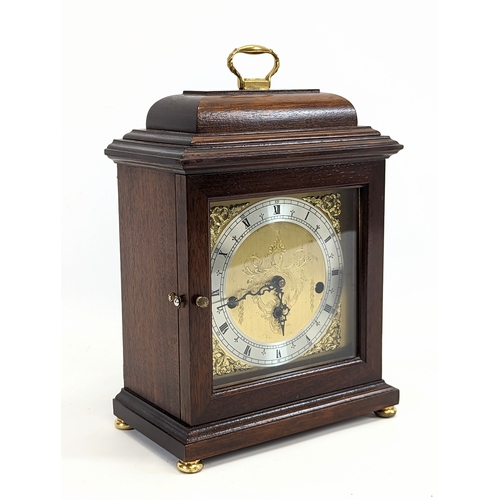 82 - A Georgian style mahogany Comitti of London mantle clock. 20x12x29.5cm