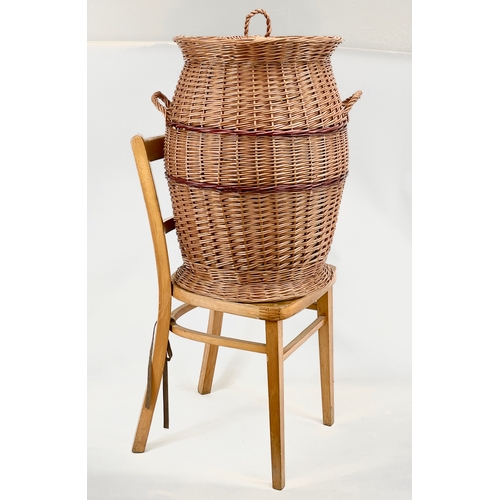 84 - A large Wicker 2 handled linen hamper with lid. 48 x 61cm