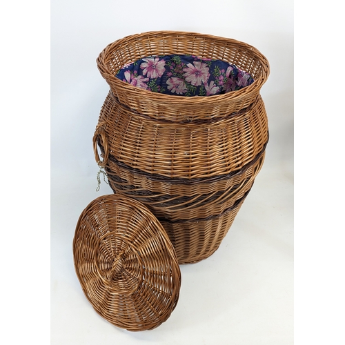 86 - A large wicker 2 handled linen hamper with lid.