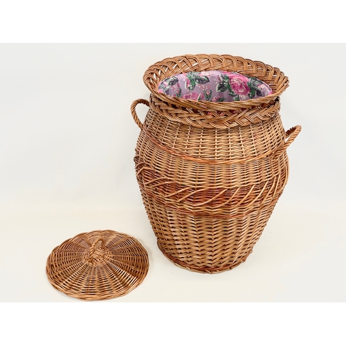 85 - A large wicker 2 handled linen hamper with lid. 48 x 61cm