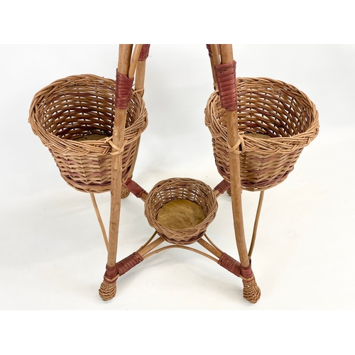 88 - A tall wicker plantstand. 96.5cm