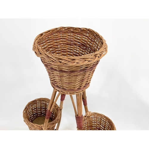 88 - A tall wicker plantstand. 96.5cm