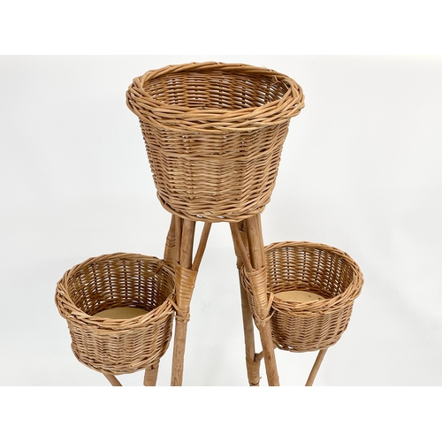 90 - A tall wicker plantstand. 103cm