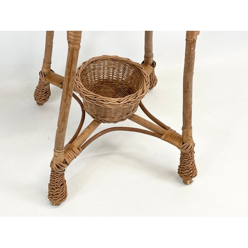 90 - A tall wicker plantstand. 103cm