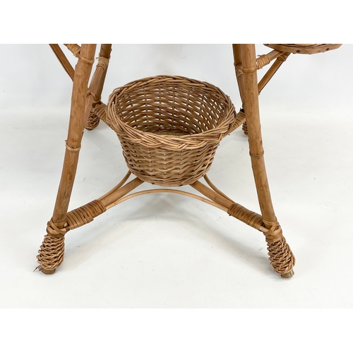 91 - A tall wicker plantstand. 90cm