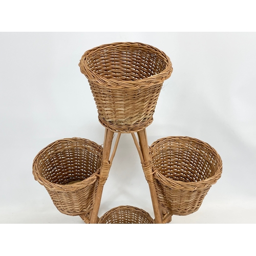 91 - A tall wicker plantstand. 90cm