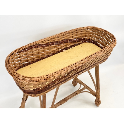 93 - A wicker planter. 70 x 30 x 58cm