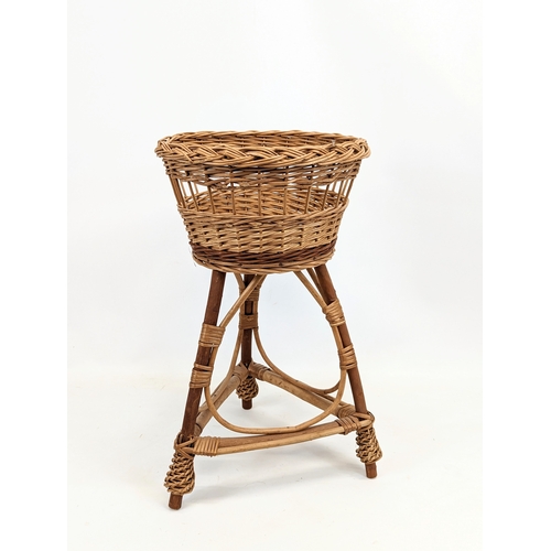 94 - 3 wicker plant stands. Tallest measures 76cm