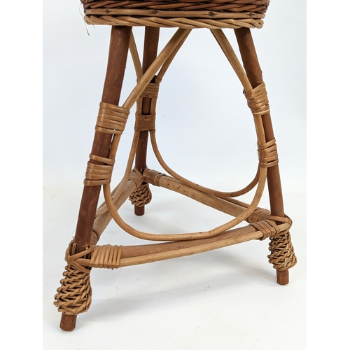 94 - 3 wicker plant stands. Tallest measures 76cm