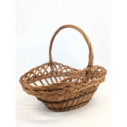 95 - A wicker basket and wicker magazine rack. Magazine rack measures 50x55cm