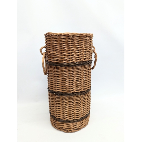 96 - 4 pieces of wicker, including 3 vases and a stick stand. Stick stand measures 42.5cm