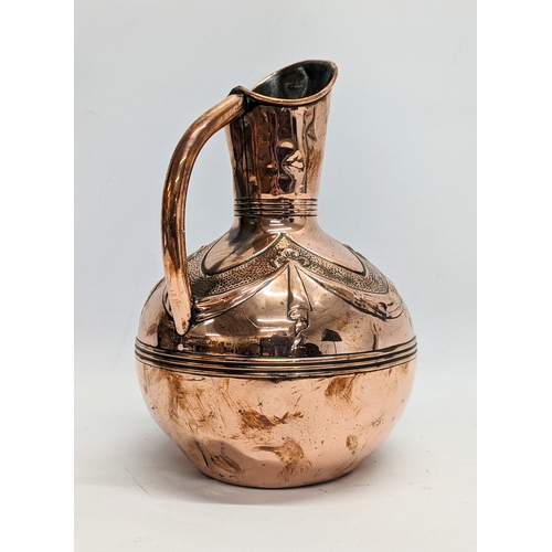 102 - A Victorian copper jug. 25cm