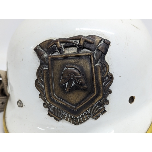 109 - A 20th century Dutch fire brigade helmet.