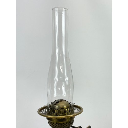 110 - A Victorian oil lamp. 67cm