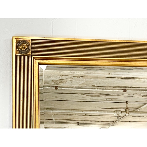 114 - A large gilt framed mirror. 109 x 140cm