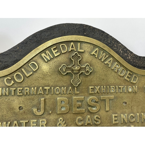 119 - A Victorian cast iron and brass wall plaque. Gold Medal Awarded At The International Exhibition Lond... 