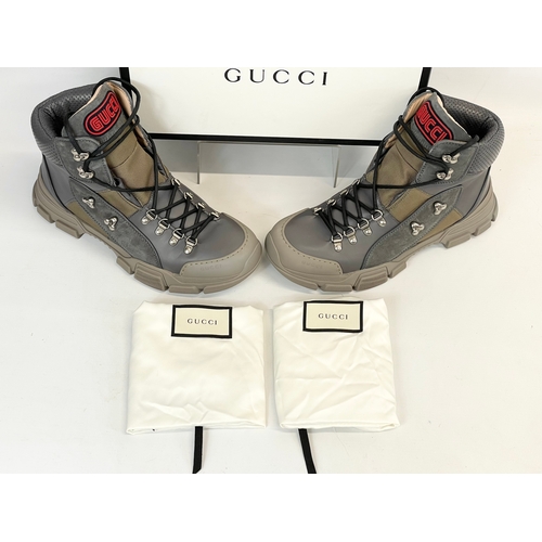 12 - A pair of Gucci boots in box. UK 9