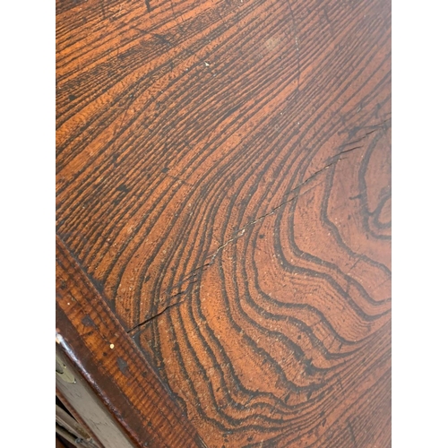 933 - A mid 19th century Korean elm table top cabinet with 8 drawers and 2 door cupboard. 97 x 38 x 48cm