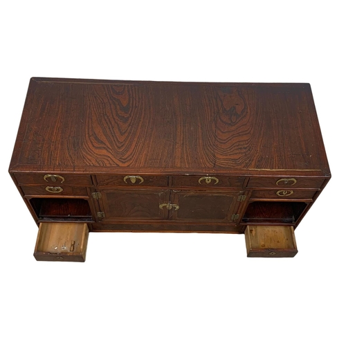 933 - A mid 19th century Korean elm table top cabinet with 8 drawers and 2 door cupboard. 97 x 38 x 48cm