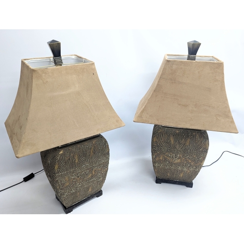 507 - A pair of large decorative table lamps. Height is 79cm with shades.