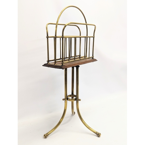 166 - A Victorian oak and brass revolving magazine / music rack. 36x77cm