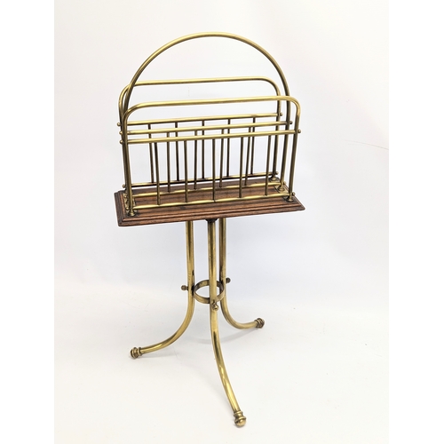 166 - A Victorian oak and brass revolving magazine / music rack. 36x77cm