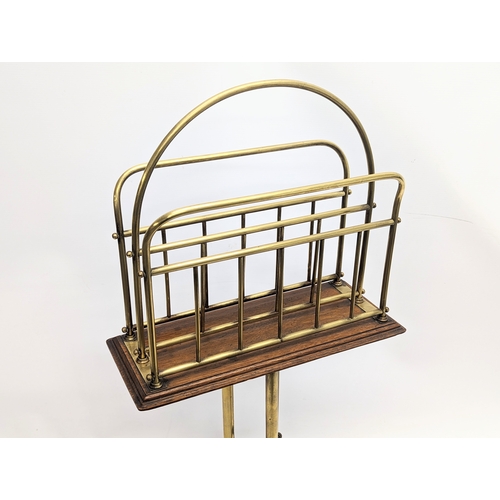 166 - A Victorian oak and brass revolving magazine / music rack. 36x77cm