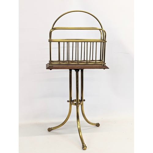 166 - A Victorian oak and brass revolving magazine / music rack. 36x77cm