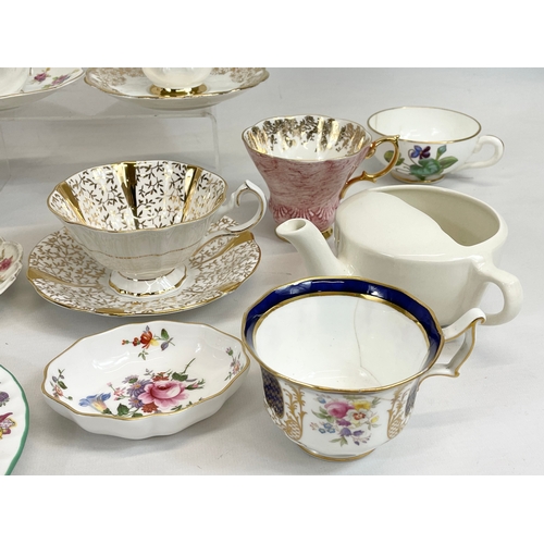 509 - A quantity of porcelain cups and saucers. Royal Albert, Royal Crown Derby, Tuscan, Minton, Cauldon, ... 