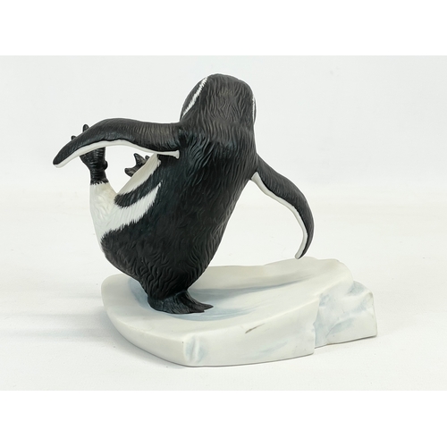 659 - A Franklin Mint “Whoops” porcelain penguin figure.