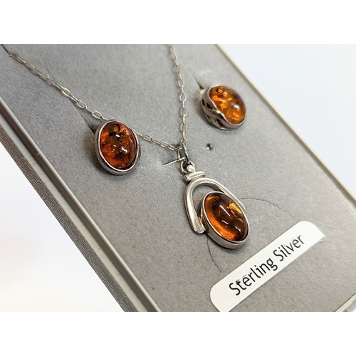 612 - An amber silver necklace and amber earring set