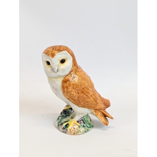 670 - A Beswick pottery barn owl with a Border Fine Arts owl figure. Tallest is 16cm