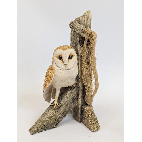 670 - A Beswick pottery barn owl with a Border Fine Arts owl figure. Tallest is 16cm