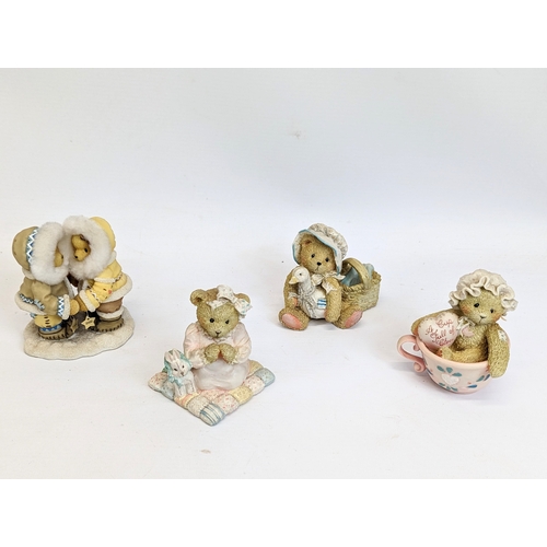 673 - A collection of Cherished Teddies figures with Mary Moo Moo figures.